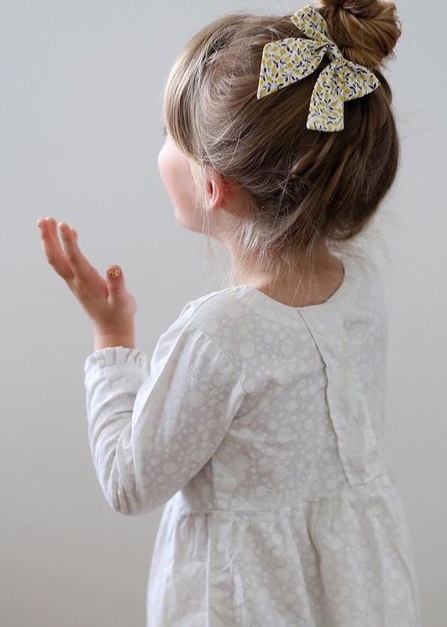 little girl with bow in her hair