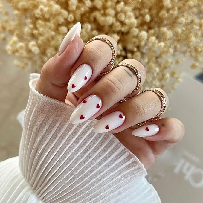 White nails with red heart print